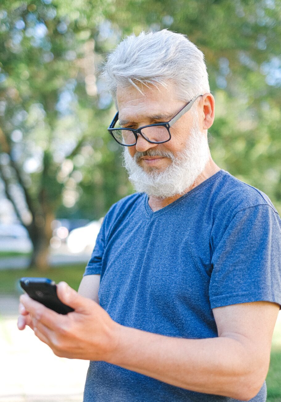 Senior man looking at phone