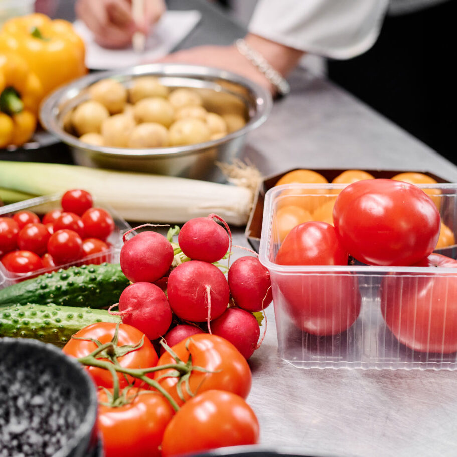 Variation of fresh vegetables for cooking Close-up of fresh ripe vegetables on table for preparing dish in kitchen of restaurant